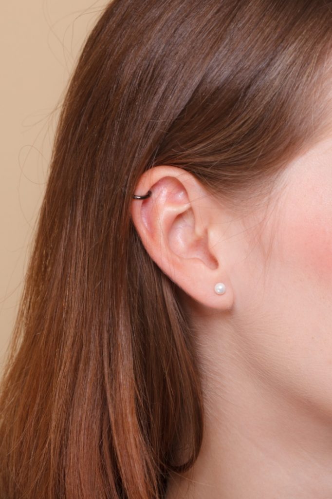 Jewelry for ear piercing and body piercing on white background