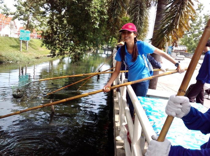 Worker cleaning a canal